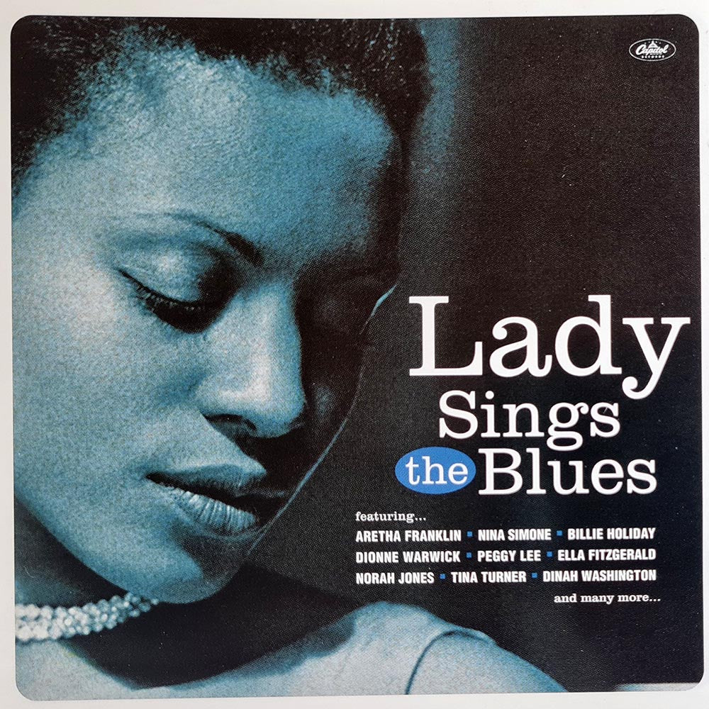 CD cover for 'Lady Sings the Blues' featuring a monochrome image of a female jazz singer with her eyes closed, wearing a pearl necklace, and the title text above.