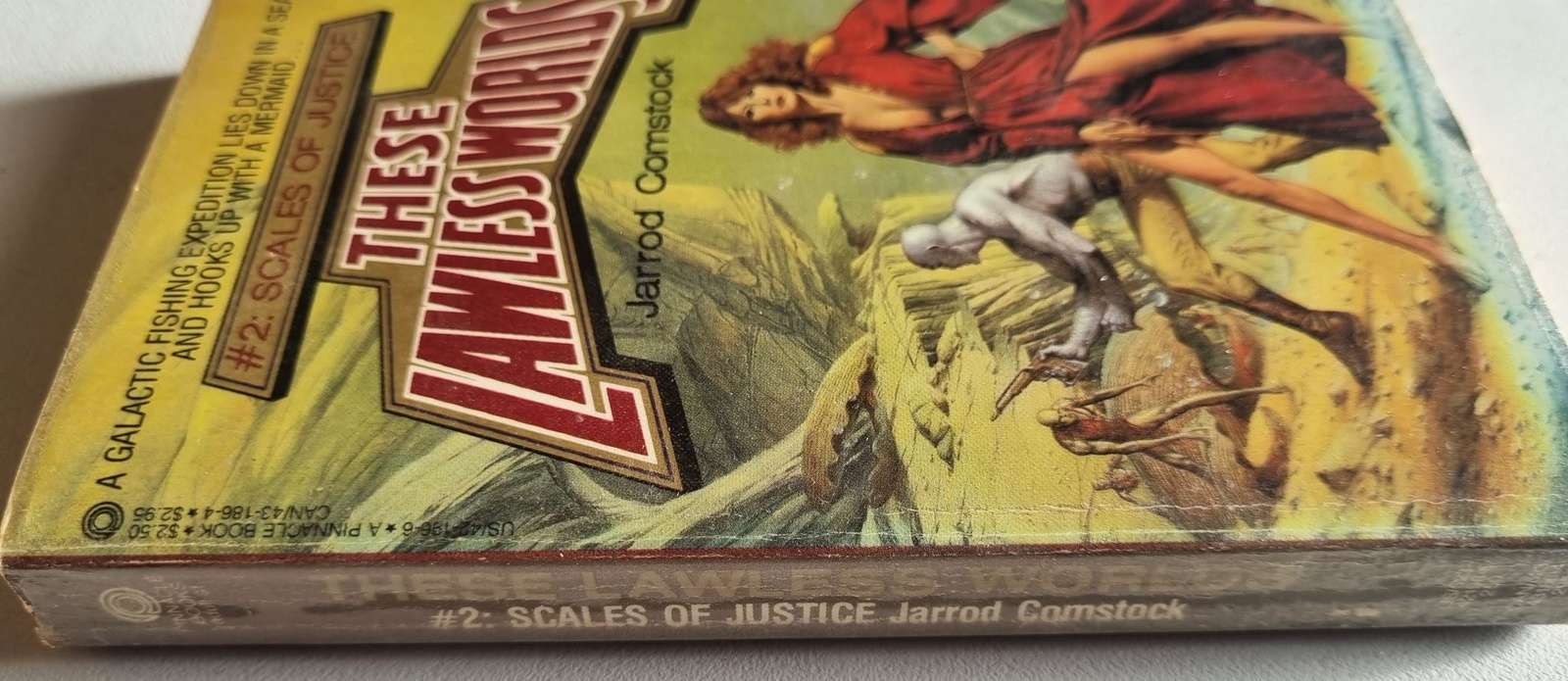 These Lawless Worlds: Scales of Justice - Jarrod Comstock