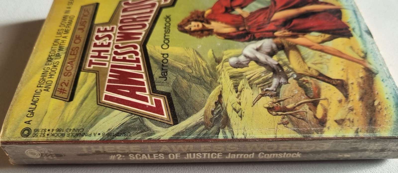 These Lawless Worlds: Scales of Justice - Jarrod Comstock